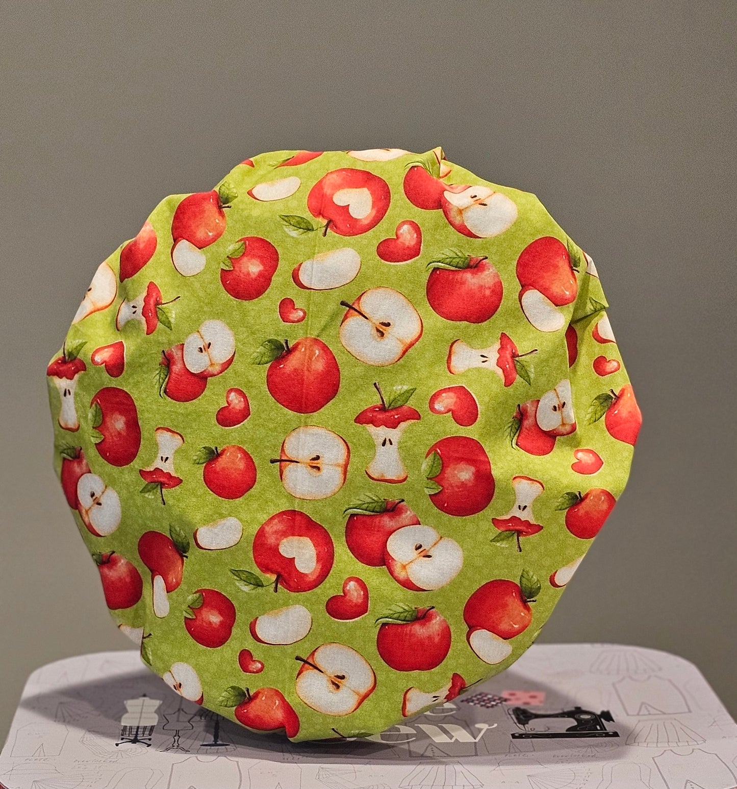 Red Apple Slices On Green Scrub Caps